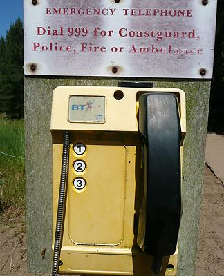 Dial 999
Maybe key in 3, 9 times?
